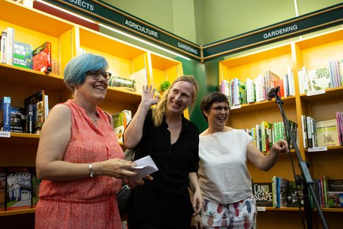 ANDREW RYAN / WINNIPEG FREE PRESS Author Miriam Toews stands with long-time friend and singer/song writer Christine Fellows, right, and Charlene Diehl, director of the Winnipeg Writers Festival, before going to the podium to read from her new book at McNally's on August 23, 2018.