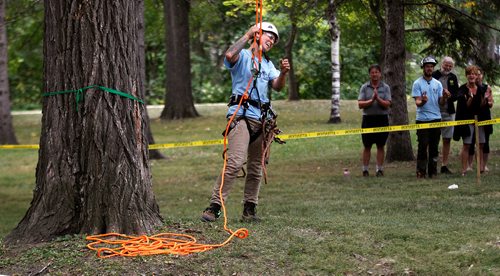 PHIL HOSSACK / WINNIPEG FREE PRESS -   Jordyn Dyck reacts to applause after her descent from the canopy in Kildonan Park Saturday Morning at the International Society of Aboriculture Prairie Chapter's 25th annual Tree Climbing   Championship. See Eric Pindera's story. - August 25, 2018