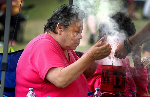 PHIL HOSSACK / WINNIPEG FREE PRESS -   St John's Park - A smudge passed around the crowd Saturday afternoon at the 'No Stone Unturned' concert. See Eric Pindera's story. - August 25, 2018