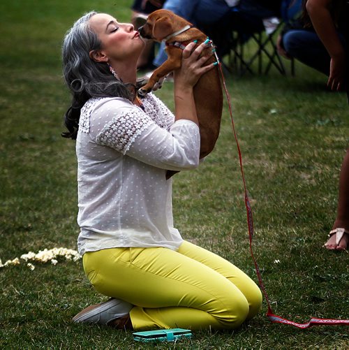 PHIL HOSSACK / WINNIPEG FREE PRESS -   St John's Park -MLA Nahanni Fontaine took in the music and the puppies Saturday afternoon at the at the 'No Stone Unturned' concert. See Eric Pindera's story. - August 25, 2018