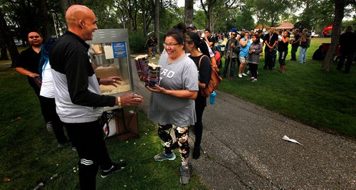 PHIL HOSSACK / WINNIPEG FREE PRESS -   St John's Park - The longest line in the park was for a bag (or two) of free popcorn Saturday afternoon at the 'No Stone Unturned' concert. See Eric Pindera's story. - August 25, 2018