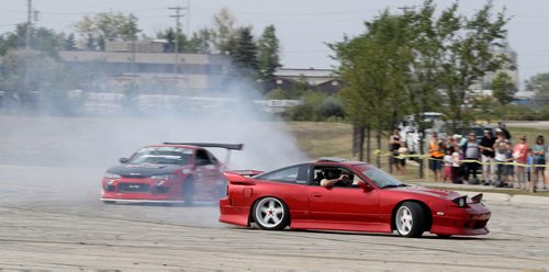 TREVOR HAGAN / WINNIPEG FREE PRESS
Collin Melody and Chris Gonzales, drifting during the Gonzo Drift demo in the parking lot at Springs Church, Sunday, August 26, 2018.