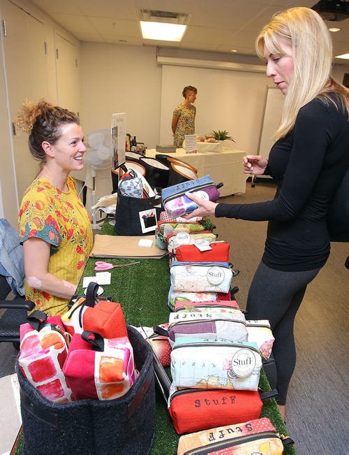 JASON HALSTEAD / WINNIPEG FREE PRESS

Shopper Steckler (right) checks out the designs of Julie Pedersen at the Cutting Edge Pop-up Shop on Aug. 16, 2018 hosted by the Canadian Mental Health Association at its Portage Avenue office. (See Social Page)