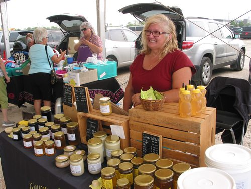 Canstar Community News Aug. 18, 2018 - St, Vital resident Rose Giguere, who operates Giguere Honey Farm with husband Ray, was selling her wares at the Red River Exhibition Park farmer's market on Aug. 18. (ANDREA GEARY/CANSTAR COMMUNITY NEWS)