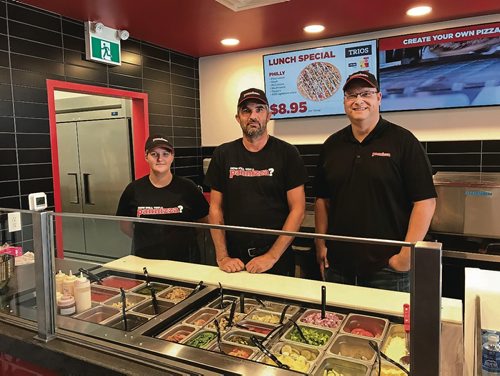 Canstar Community News (From left) Staff Brittany Liebenberg and James Finch and owner Keith Render at Winnipegs first Pannizza restaurant, located at Unit 12 - 1600 Regent Ave. West. (SHELDON BIRNIE/CANSTAR/THE HERALD)