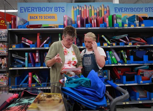 RUTH BONNEVILLE / WINNIPEG FREE PRESS

Standup photo 
Families take advantage of the cool weather to do their back-to-school shopping with their kids at Walmart on Grant on Monday afternoon. 

Alarra Anderson looks over her grade 7, school supply list with her grandmother, Alexis Anderson, in the binder aisle Monday. 

August 27/18
