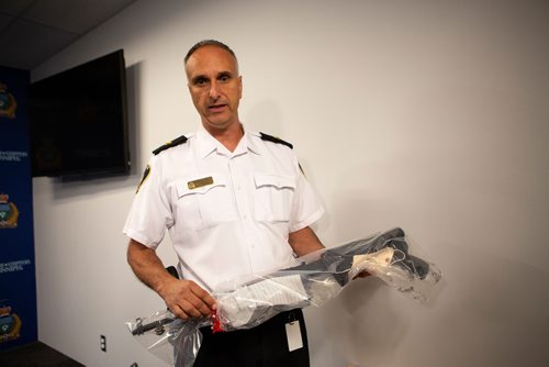 ANDREW RYAN / WINNIPEG FREE PRESS Winnipeg Police investigator Max Waddell presents a SKS rifle which was found and seized as part of an investigation into the illegal distribution of methamphetamine on August 23, 2018. Shot at a Police press conference on August 28, 2018.