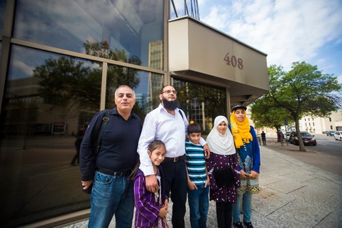 MIKAELA MACKENZIE / WINNIPEG FREE PRESS
Michael Kalo, (left), Tamiyah Mubeen, Azhar Mubeen, Buraq Mubeen, Hafsah Mubeen, and Khudija Mubeen pose in front of the courthouse in Winnipeg on Wednesday, Aug. 29, 2018. The Mubeen family is fighting a $27,000 water bill.
Winnipeg Free Press 2018.