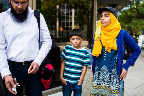 MIKAELA MACKENZIE / WINNIPEG FREE PRESS
Azhar (left), Buraq, and Khudija Mubeen speak to media in front of the courthouse in Winnipeg on Wednesday, Aug. 29, 2018. The Mubeen family had is fighting a $27,000 water bill.
Winnipeg Free Press 2018.