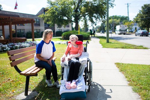 MIKAELA MACKENZIE / WINNIPEG FREE PRESS
Winnie Best, resident at the Lions Prairie Manor Personal Care Home (right), and friend Adrienne Lasson enjoy the sun in Portage la Prairie on Wednesday, Aug. 29, 2018. Lasson says that she loves visiting with Winnie, but did note that it was a hassle that the top floor kitchen was closed, because residents now need to be brought down the elevator for their meals.
Winnipeg Free Press 2018.