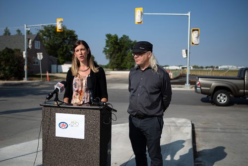 ANDREW RYAN / WINNIPEG FREE PRESS CAA representative Liz Kulyk, and Mark Cohoe, executive director of Bike Winnipeg announce the results of a survey on road bike safety in the city on August 29, 2018.