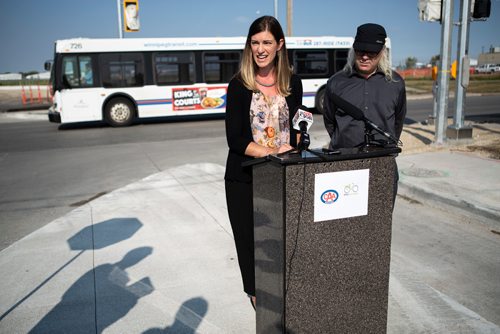 ANDREW RYAN / WINNIPEG FREE PRESS CAA representative Liz Kulyk, and Mark Cohoe, executive director of Bike Winnipeg announce the results of a survey on road bike safety in the city on August 29, 2018.