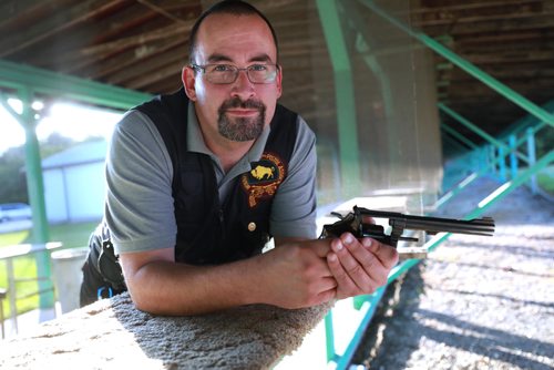 RUTH BONNEVILLE / WINNIPEG FREE PRESS


Brenden Roerich, President of the Winnipeg Revolver & Pistol Association, holds a Smith & Wesson Model 22 calibre gun in the target practice area Wednesday.

For story on banning handguns.  

See Dylan Robertson story. 
August 29/18
