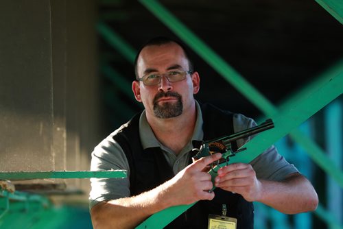 RUTH BONNEVILLE / WINNIPEG FREE PRESS


Brenden Roerich, President of the Winnipeg Revolver & Pistol Association, holds a Smith & Wesson Model 22 calibre gun in the target practice area Wednesday.

For story on banning handguns.  

See Dylan Robertson story. 
August 29/18
