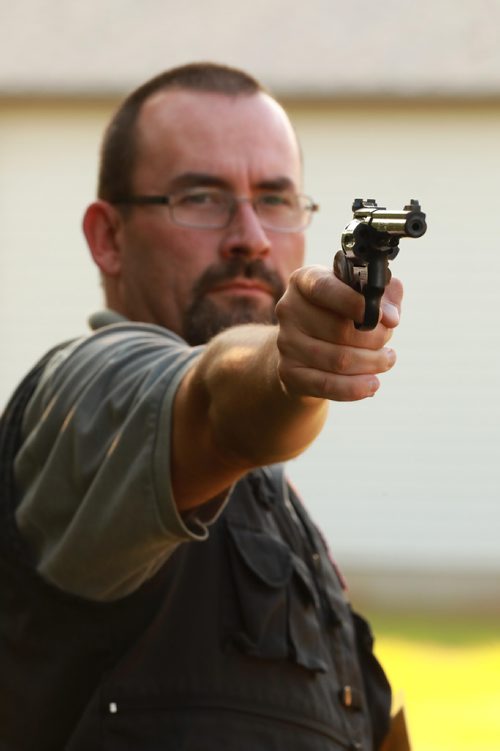 RUTH BONNEVILLE / WINNIPEG FREE PRESS


Brenden Roerich, President of the Winnipeg Revolver & Pistol Association, holds a Smith & Wesson Model 22 calibre gun in the target practice area Wednesday.

For story on banning handguns.  

See Dylan Robertson story. 
August 29/18
