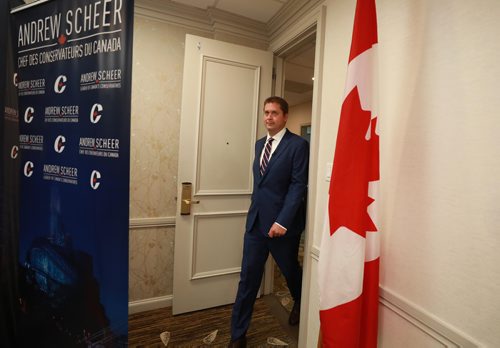 RUTH BONNEVILLE / WINNIPEG FREE PRESS


Leader of the Conservative Party of Canada, Andrew Scheer, walks into a conference room at the Delta Hotel in Winnipeg for news conference with reporters Thursday.

See Larry's story. 

August 30/18
