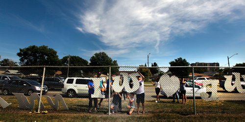 PHIL HOSSACK / WINNIPEG FREE PRESS - Students and staff from Brock Corydon School assemble and mount a "We Love Winnipeg" sign along southbound route 90 Thursday afternoon. See Doug Spiers? and or teacher Susan Pereles at spereles@wsd1.org for more info.  - August 30, 2018