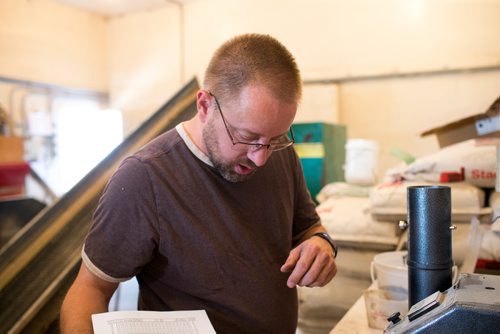 MIKAELA MACKENZIE / WINNIPEG FREE PRESS
Farmer Markus Isaac tests the hemp seeds for humidity percentage before harvesting near Kleefeld, Manitoba on Thursday, Aug. 30, 2018. 
Winnipeg Free Press 2018.