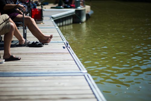 MIKAELA MACKENZIE / WINNIPEG FREE PRESS
Anja Rowntree enjoys the sun while fishing in bare feet at the annual Fall Fishing Derby at The Forks in Winnipeg on Saturday, Sept. 1, 2018.
Winnipeg Free Press 2018.