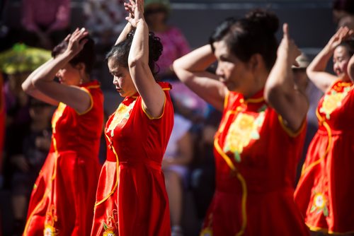 MIKAELA MACKENZIE / WINNIPEG FREE PRESS
Sue Van Vong (centre) performs with the Friendly Chinese Dance Association at the Chinatown Street Festival in Winnipeg on Saturday, Sept. 1, 2018.
Winnipeg Free Press 2018.