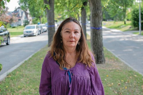 Canstar Community News Aug. 28, 2018 - Barb Ashley's son Robert died of a drug overdose in January. She has tied purple ribbons around the trees in her St. James neighbourhood to raise awareness. (EVA WASNEY/CANSTAR COMMUNITY NEWS/METRO)