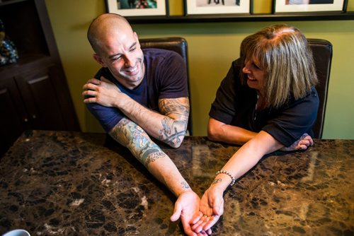 MIKAELA MACKENZIE / WINNIPEG FREE PRESS
Darcy (left) and Anne Oake show their matching tattoos in memory of Bruce in Winnipeg on Tuesday, Sept. 4, 2018. The family is dedicated to opening the Bruce Oake Recovery Centre, a project sparked by the tragic death of their son Bruce seven years ago.
Winnipeg Free Press 2018.