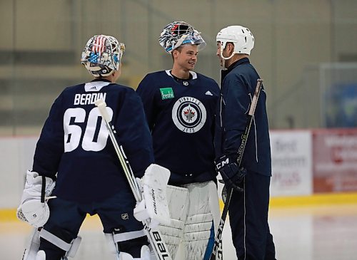RUTH BONNEVILLE / WINNIPEG FREE PRESS 


Winnipeg Jets 2 Goalie #1, Eric Comrie chats with Dave Cameron just before heading to the net during practice with other members of the Jets at Iceplex Tuesday. 

September 4/18 
