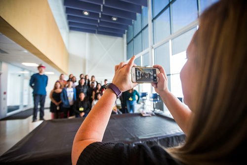 MIKAELA MACKENZIE / WINNIPEG FREE PRESS
Mallory Wray takes a picture of a group of volunteer students before the grand opening of the expanded campus of Southeast Collegiate, a secondary school that welcomes First Nations students from communities across Manitoba, in Winnipeg on Thursday, Sept. 6, 2018. 
Winnipeg Free Press 2018.