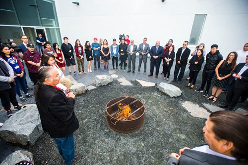 MIKAELA MACKENZIE / WINNIPEG FREE PRESS
Students and special guests take part in a ceremony around the ceremonial fire pit to mark the official opening of the expanded campus of Southeast Collegiate, a secondary school that welcomes First Nations students from communities across Manitoba, in Winnipeg on Thursday, Sept. 6, 2018. 
Winnipeg Free Press 2018.