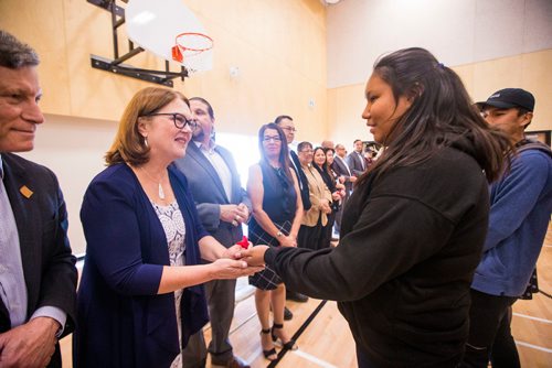 MIKAELA MACKENZIE / WINNIPEG FREE PRESS
Miranda Crate offers a tobacco tie to Minister Jane Philpott at the grand opening of the expanded campus of Southeast Collegiate, a secondary school that welcomes First Nations students from communities across Manitoba, in Winnipeg on Thursday, Sept. 6, 2018. 
Winnipeg Free Press 2018.
