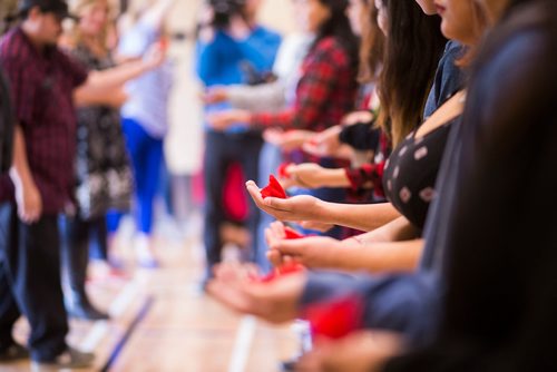 MIKAELA MACKENZIE / WINNIPEG FREE PRESS
Students offer tobacco ties at the grand opening of the expanded campus of Southeast Collegiate, a secondary school that welcomes First Nations students from communities across Manitoba, in Winnipeg on Thursday, Sept. 6, 2018. 
Winnipeg Free Press 2018.