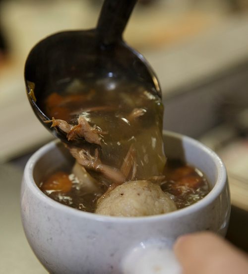 MIKE DEAL / WINNIPEG FREE PRESS
Nathan Detroit's Lunch Pad, 1 Lombard Place (directly beneath the Richardson Bldg/Fairmont Hotel) 
Brenlea Yamron serves up a bowl of their popular Matzo ball soup.
180906 - Thursday, September 06, 2018.