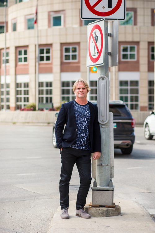 MIKAELA MACKENZIE / WINNIPEG FREE PRESS
Brent Bellamy, architect and active advocate for opening Portage and Main to pedestrians, poses for a portrait at the famed intersection in Winnipeg on Thursday, Sept. 6, 2018. 
Winnipeg Free Press 2018.