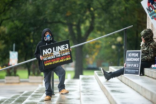 MIKAELA MACKENZIE / WINNIPEG FREE PRESS
Adonis Maxie, nine, holds a sign at a rally calling for a clean energy future in front of the Manitoba Legislative Building  in Winnipeg on Saturday, Sept. 8, 2018. 
Winnipeg Free Press 2018.