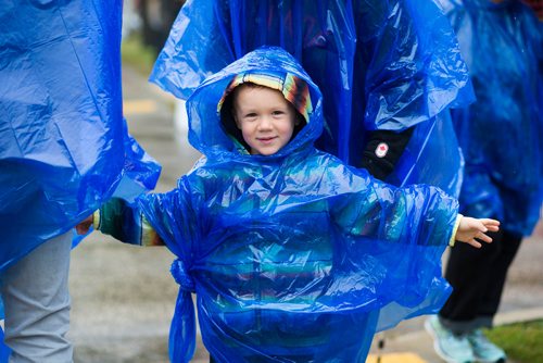 MIKAELA MACKENZIE / WINNIPEG FREE PRESS
Kellen MacKay, three, gets his rain poncho adjusted at Manyfest in Winnipeg on Saturday, Sept. 8, 2018. 
Winnipeg Free Press 2018.