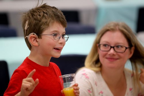 TREVOR HAGAN / WINNIPEG FREE PRESS
Mathew Spears, 7, a cochlear implant recipient, with his mother, Erin, Sunday, September 9, 2018, 2018. Mathew is one of more than 200 patients who gathered at Waverly Heights Community Centre to celebrate after HSC Surgical Hearing Implant Program reached the milestone of having performed 250 implants.