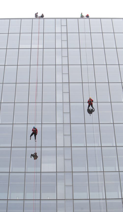 JASON HALSTEAD / WINNIPEG FREE PRESS

L-R: Donna Grieve and Janet Hewitt of the Over The Edge Team rappel in the 14th Annual Easter Seals Drop Zone, a fundraising event in support of the Society for Manitobans with Disabilities (SMD), at the Manitoba Hydro Building in Downtown Winnipeg on Aug. 28, 2018. (See Social Page)