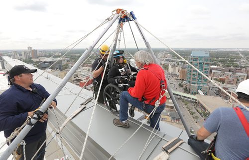 JASON HALSTEAD / WINNIPEG FREE PRESS

Society for Manitobans with Disabilities (SMD) Foundation/Easter Seals Manitoba Ability Rappeller Samantha Brouillette gets ready for her drop at the 14th Annual Easter Seals Drop Zone, a fundraising event in support of SMD, at the Manitoba Hydro Building in Downtown Winnipeg on Aug. 28, 2018. (See Social Page)