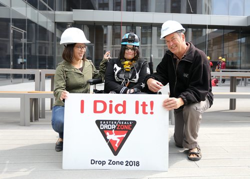 JASON HALSTEAD / WINNIPEG FREE PRESS

Society for Manitobans with Disabilities (SMD) Foundation/Easter Seals Manitoba Ability Rappeller Samantha Brouillette is congratulated by representatives of her corporate sponsor Mercer Canada, Dustine Isaga (left) and John Dueck (right), after she touched down at the 14th Annual Easter Seals Drop Zone, a fundraising event in support of SMD, at the Manitoba Hydro Building in Downtown Winnipeg on Aug. 28, 2018. (See Social Page)