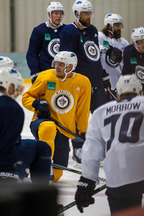 MIKE DEAL / WINNIPEG FREE PRESS
Winnipeg Jets' Dmitry Kulikov (5) wears a yellow jersey while taking part in a pre-season skate at the BellMTS IcePlex Monday morning. 
180910 - Monday, September 10, 2018.