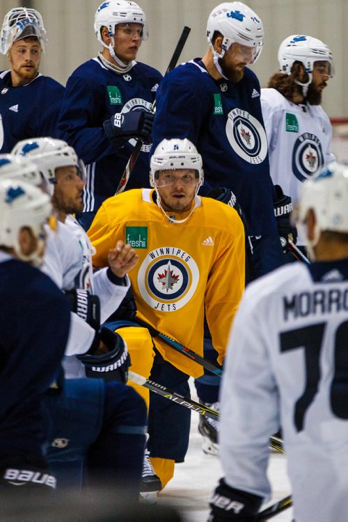 MIKE DEAL / WINNIPEG FREE PRESS
Winnipeg Jets' Dmitry Kulikov (5) wears a yellow jersey while taking part in a pre-season skate at the BellMTS IcePlex Monday morning. 
180910 - Monday, September 10, 2018.
