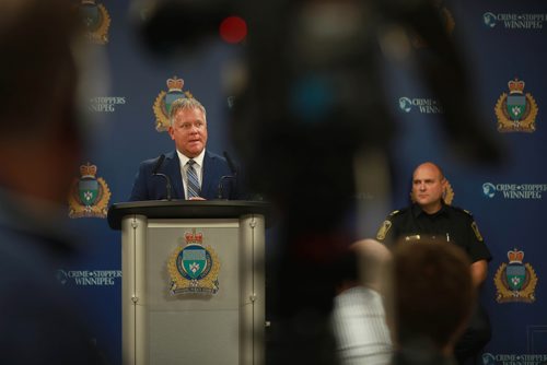 RUTH BONNEVILLE / WINNIPEG FREE PRESS 

Ward Keith, VP of Business Development with MPI, talks to the media about MPI funding $70,000 to police agencies to enhance school zone safety, at presser at WPS Headquarters Monday.

Police staff Sargent, Sean Pollock also spoke at presser.  

 September 10/18 
