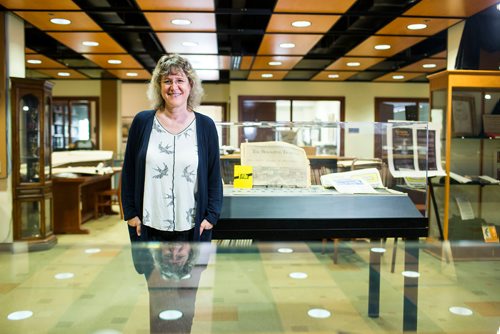 MIKAELA MACKENZIE / WINNIPEG FREE PRESS
Archivist Shelley Sweeney poses with copies of the Winnipeg Tribune at the University of Manitoba archives in Winnipeg on Monday, Sept. 10, 2018.  The university has completely digitized the newspaper, which was in operation from 1890 to August 1980.
Winnipeg Free Press 2018.