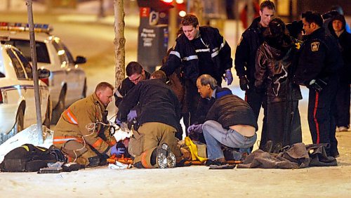 BORIS MINKEVICH / WINNIPEG FREE PRESS 090218 A male that was found in front of the Manwin Hotel on Main Street was trasported to hospital in critical Wed. evening.