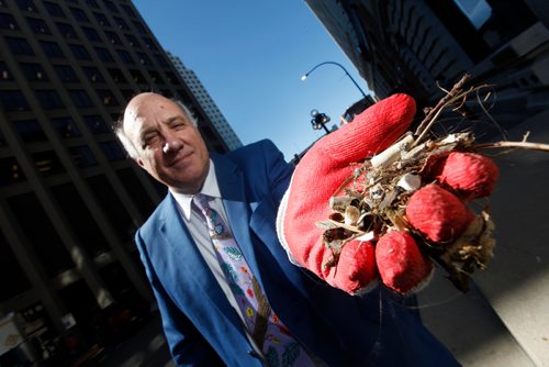 PHIL HOSSACK / WINNIPEG FREE PRESS - Tom Ethans of Take Pride Winnipeg holds out a handfull cigarette butts it took him minutes to gather along main street. See story.  - Sept 10, 2018