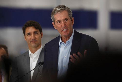 MIKE DEAL / WINNIPEG FREE PRESS
Prime Minister Justin Trudeau looks on while Manitoba Premier Brian Pallister talks during a press conference at a new 700 employee Canada Goose manufacturing facility in Winnipeg. 
180911 - Tuesday, September 11, 2018.