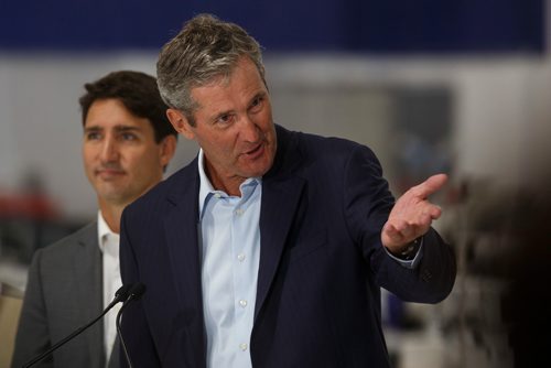 MIKE DEAL / WINNIPEG FREE PRESS
Prime Minister Justin Trudeau looks on while Manitoba Premier Brian Pallister talks during a press conference at a new 700 employee Canada Goose manufacturing facility in Winnipeg. 
180911 - Tuesday, September 11, 2018.