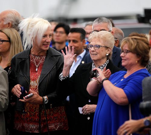 PHIL HOSSACK / WINNIPEG FREE PRESS - Former Lt Governor Pearl McGonnigal waves as Fashion Mogul Peter Nygard introducers her to guests at a ribbon cutting ceremony at Nygard fashions head office Wednesday evening. - Sept 12, 2018