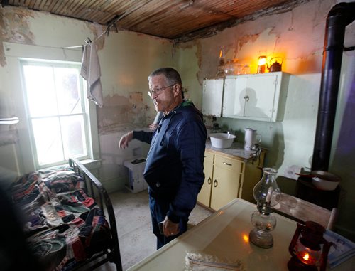 PHIL HOSSACK / WINNIPEG FREE PRESS - Deloraine's Grant Law surveys the restored Nygard family home Wednesday evening, he helped Fashion Mogul Peter Nygard move to the Nygard Fashions head office. - Sept 12, 2018
