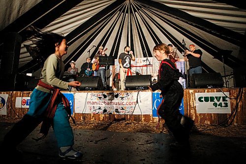 BORIS MINKEVICH / WINNIPEG FREE PRESS 090219 (right) Calista St. Hilaire,9, and (left)Angeleka Bisson,9, dance to the sweet sounds of Winnipeg french music band called Les Soeurs Valades in the Sugar Shack on festival grounds.
